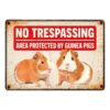 Sign Metal No Trespassing Area protected by Guinea Pigs